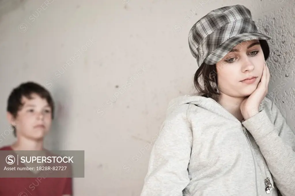 Girl and Boy Leaning on Wall