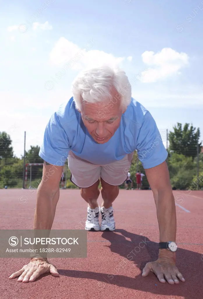 Man Exercising Outdoors on Track