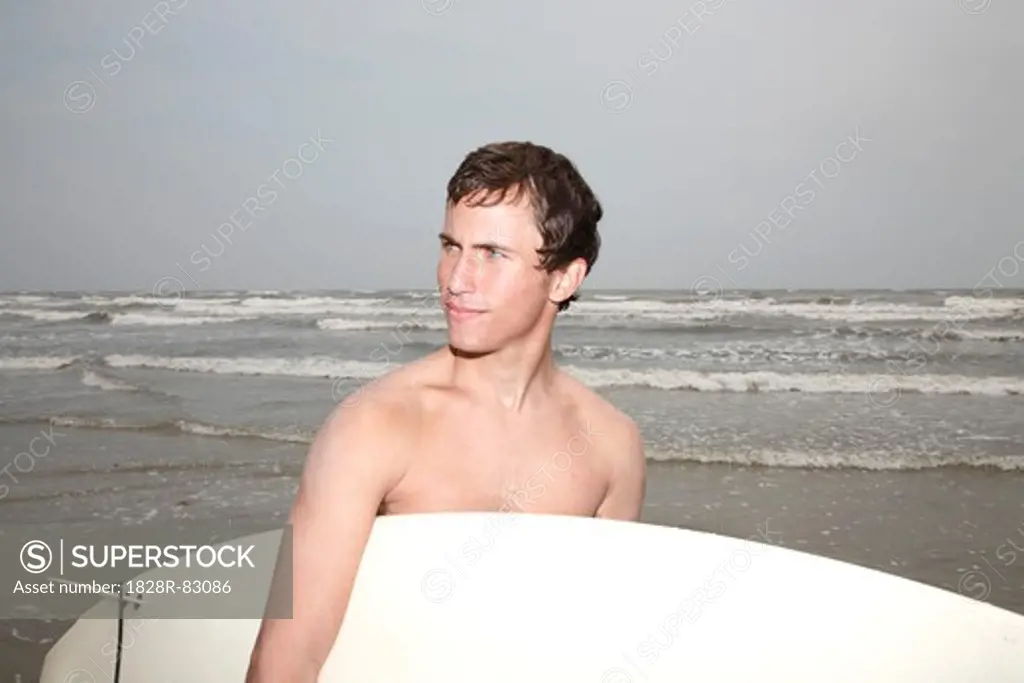 Man Holding Surfboard, Galveston, Galveston Island, Galveston County, Texas, USA