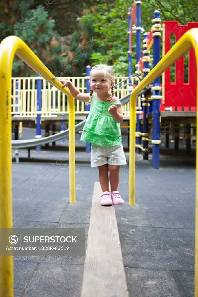 Girl Playing in Washington Park Playground, Portland, Oregon, USA