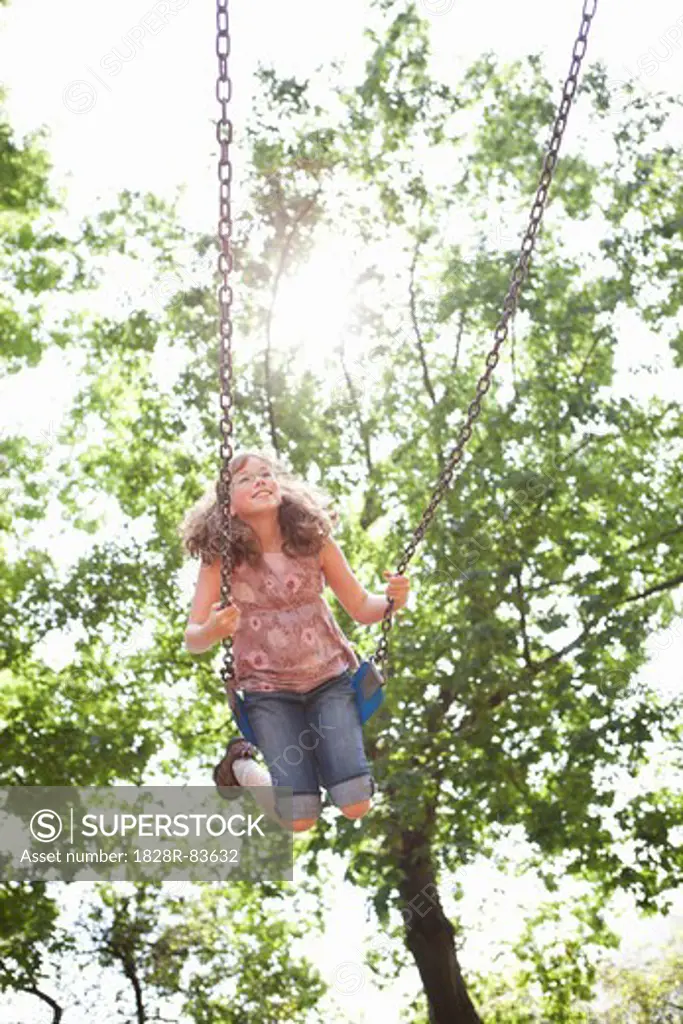 Girl Playing on Swings, Washington Park Playground, Portland, Oregon, USA