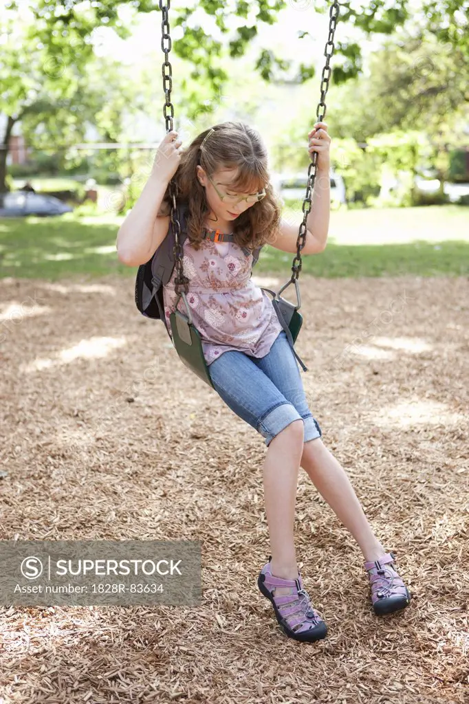 Girl Playing on Swings, Washington Park Playground, Portland, Oregon, USA