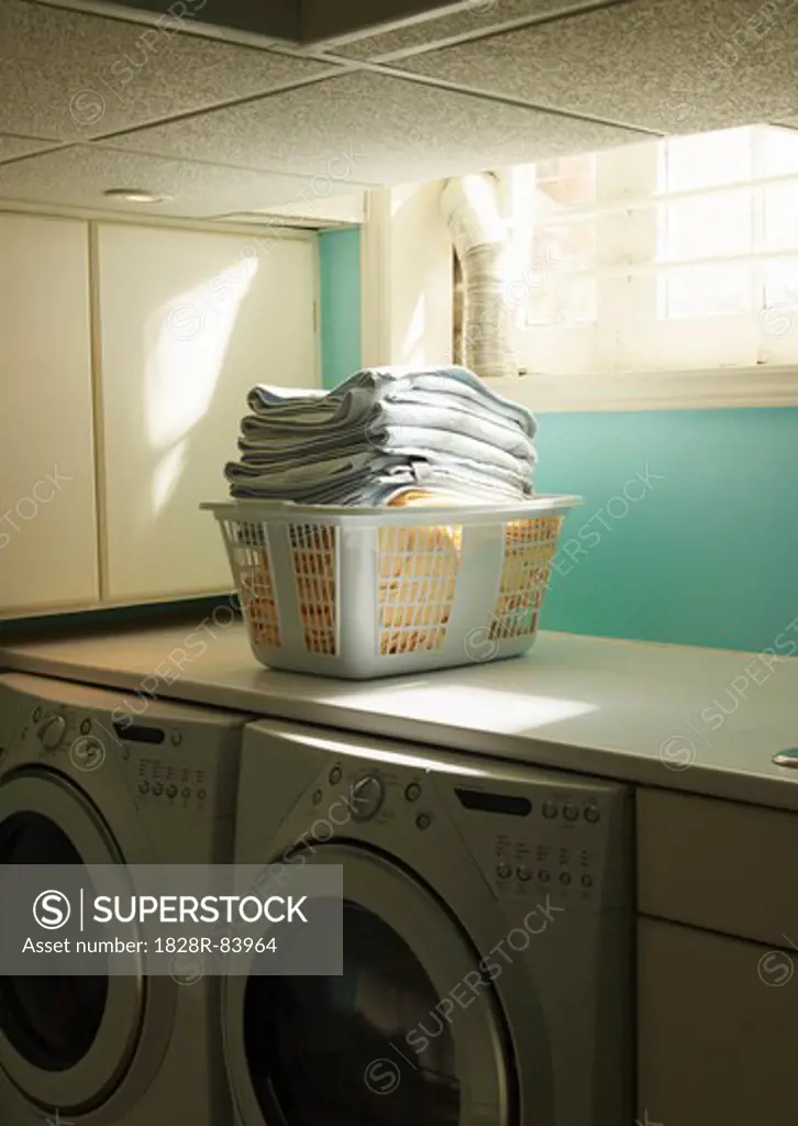Folded Laundry in Basket in Laundry Room