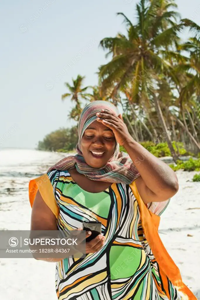 Woman Looking at Snapshots, Nyota Beach, Unguja, Zanzibar, Tanzania