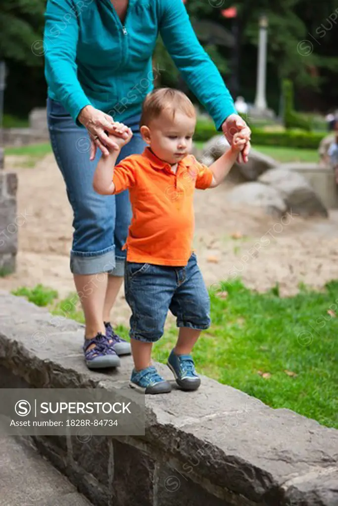 Mother and Son Walking on Stone Wall, Washington Park, Portland, Oregon, USA