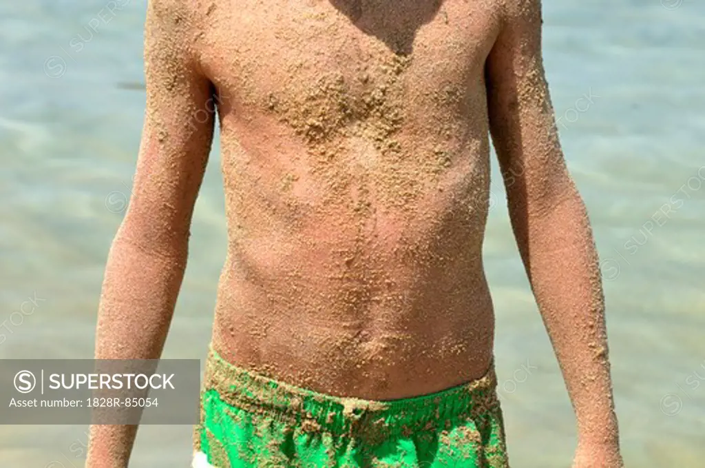 Boy Covered in Sand, Saint-florent, Corsica, France