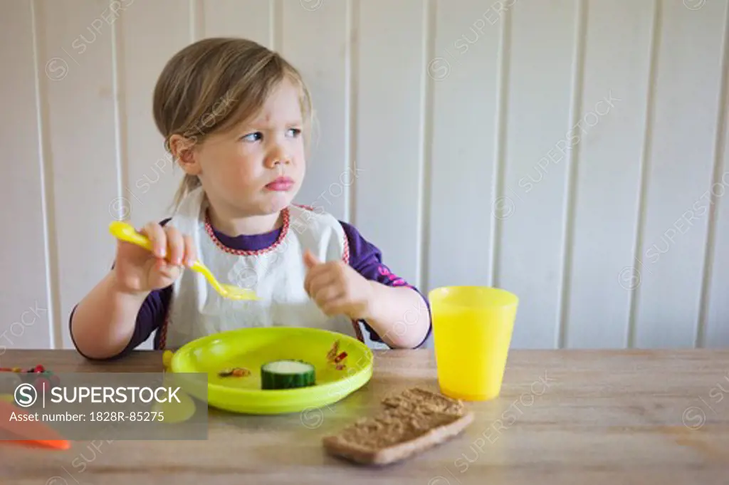 Young Girl Eating at Table, Sweden