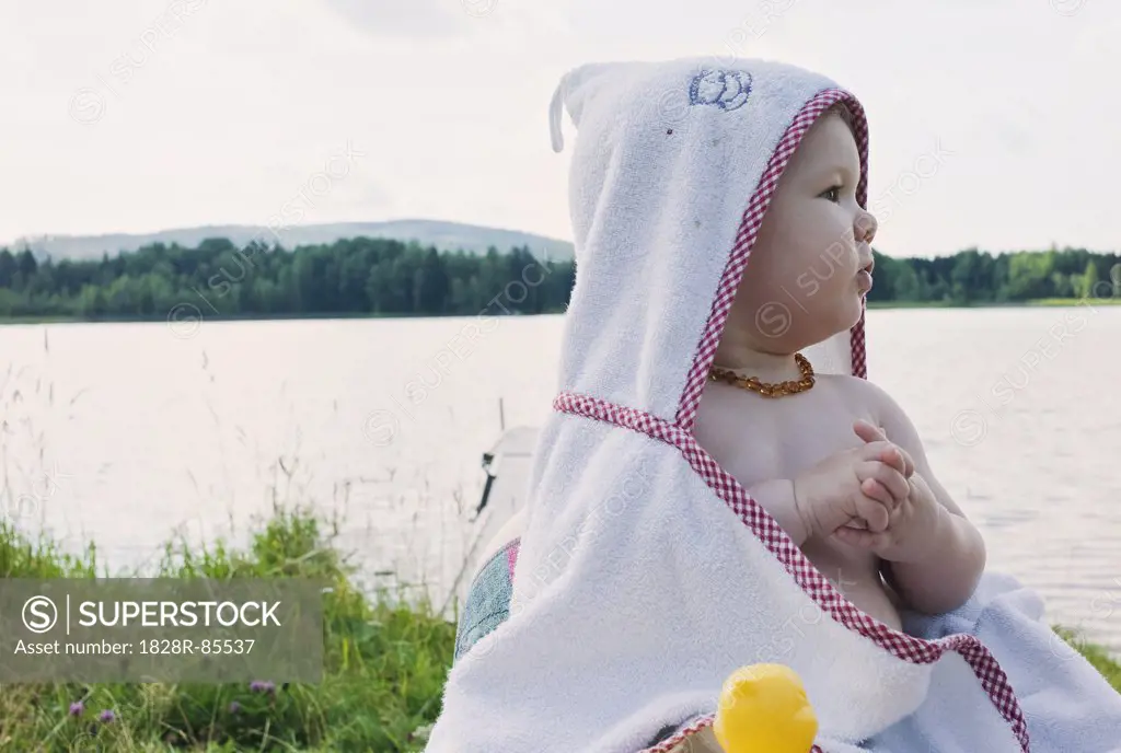 Baby Girl in Towel by Lake