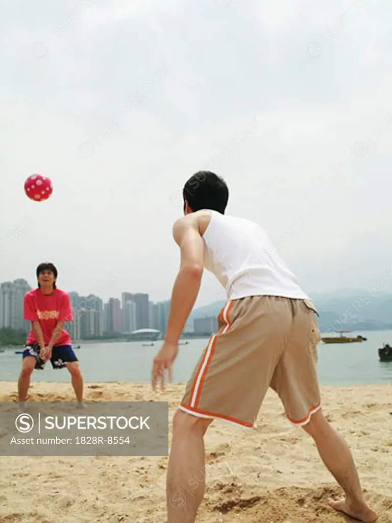 Men Playing With Ball on Beach   