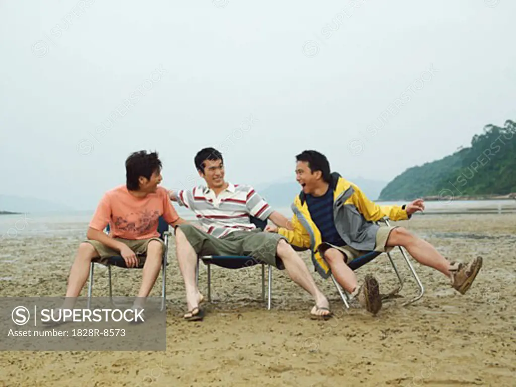 Men Goofing Around on the Beach   