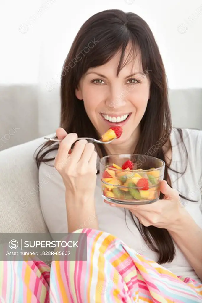 Close-up of Woman Eating Bowl of Fruit