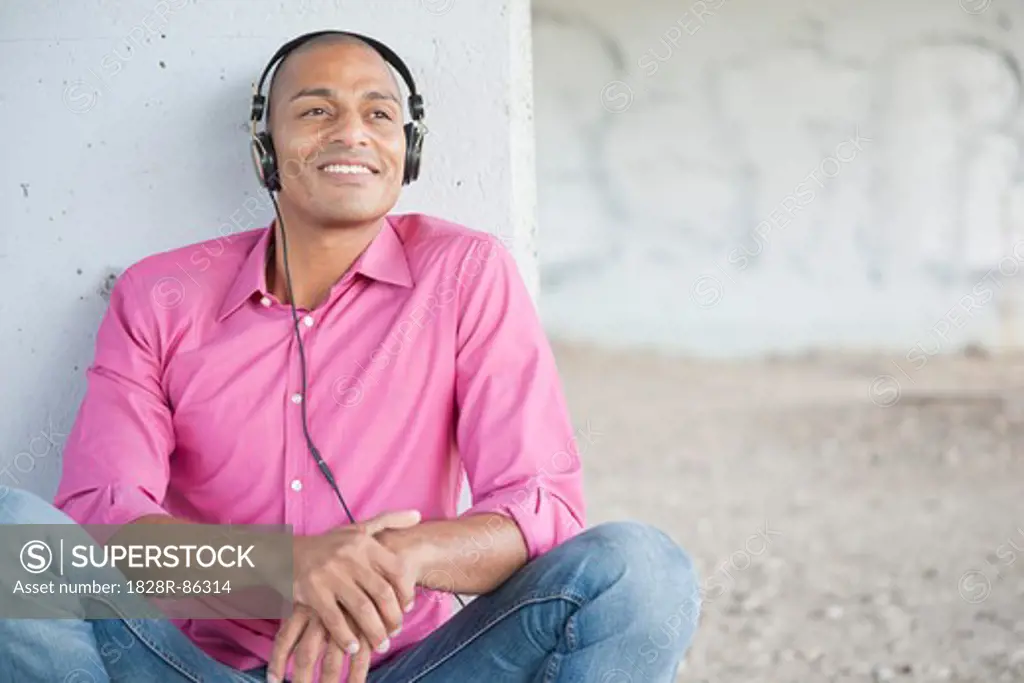 Portrait of Man using Headphones