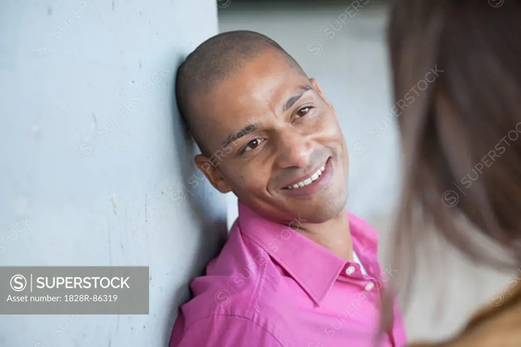 Close-up of Man Speaking with Woman