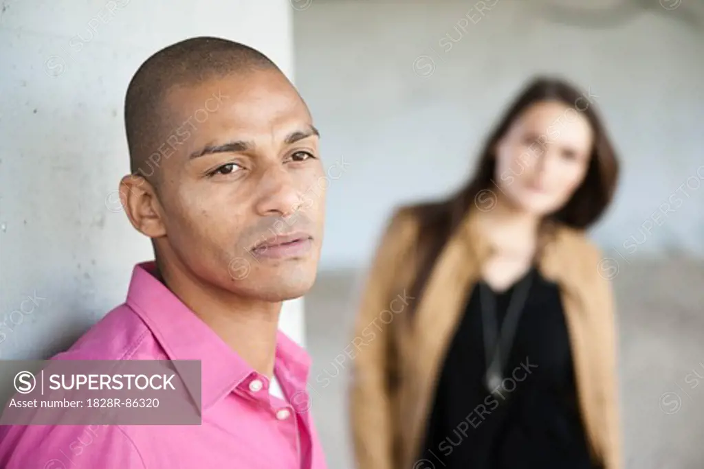 Portrait of Man with Woman in Background