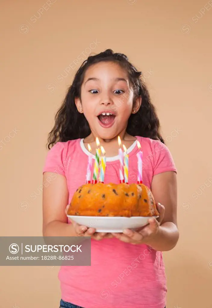 Portrait of Girl Blowing Out Candles