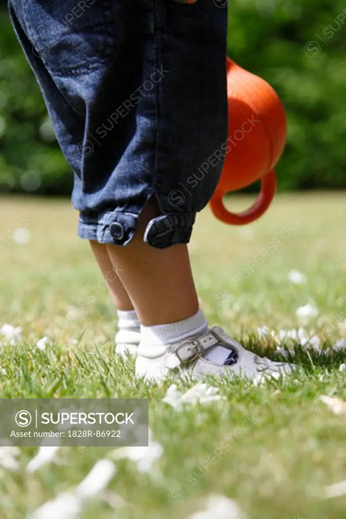 Legs and Feet of Baby Girl Standing on Grass in Garden, Farnham, England