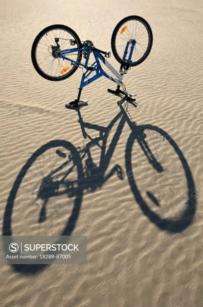 Bicycle Truned Upside Down on Beach