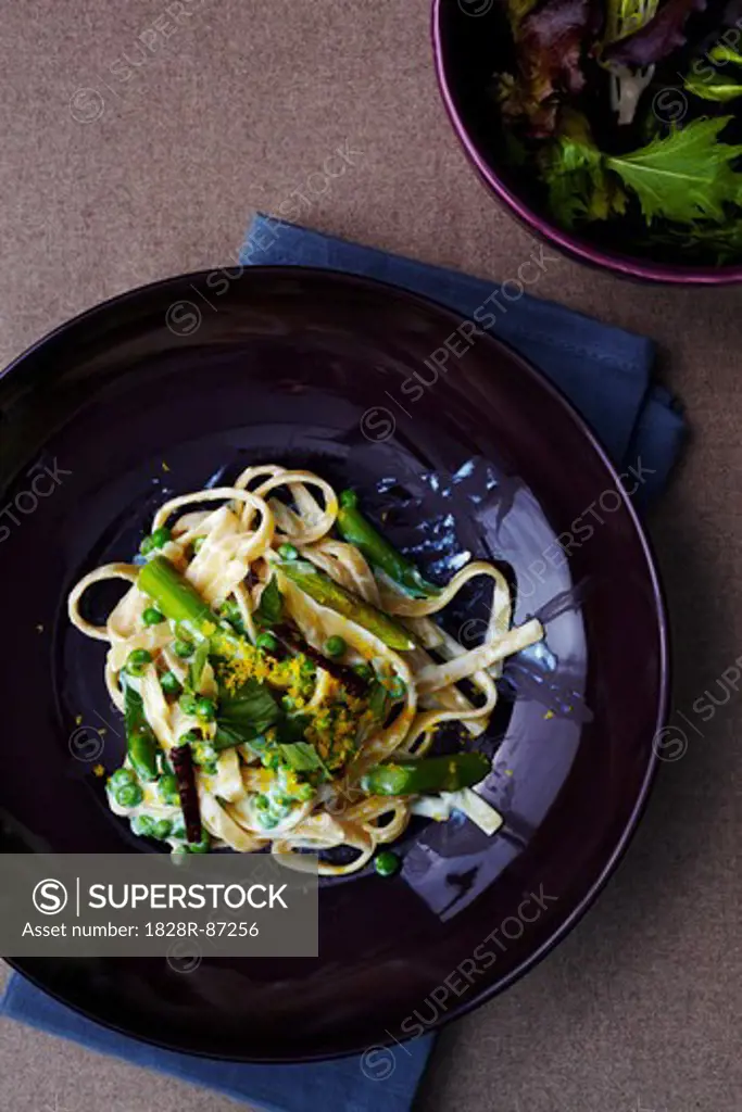 Fettuccine Alfredo with Asparagus and Peas on Plate