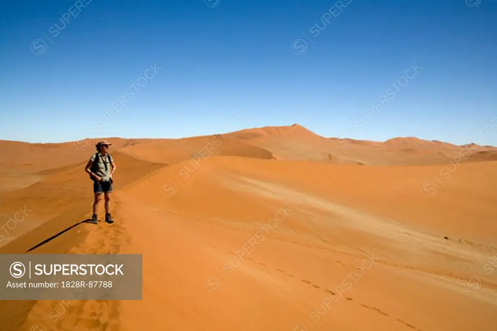 Woman Standing on Sand Dune, Namib-Naukluft National Park, Namibia