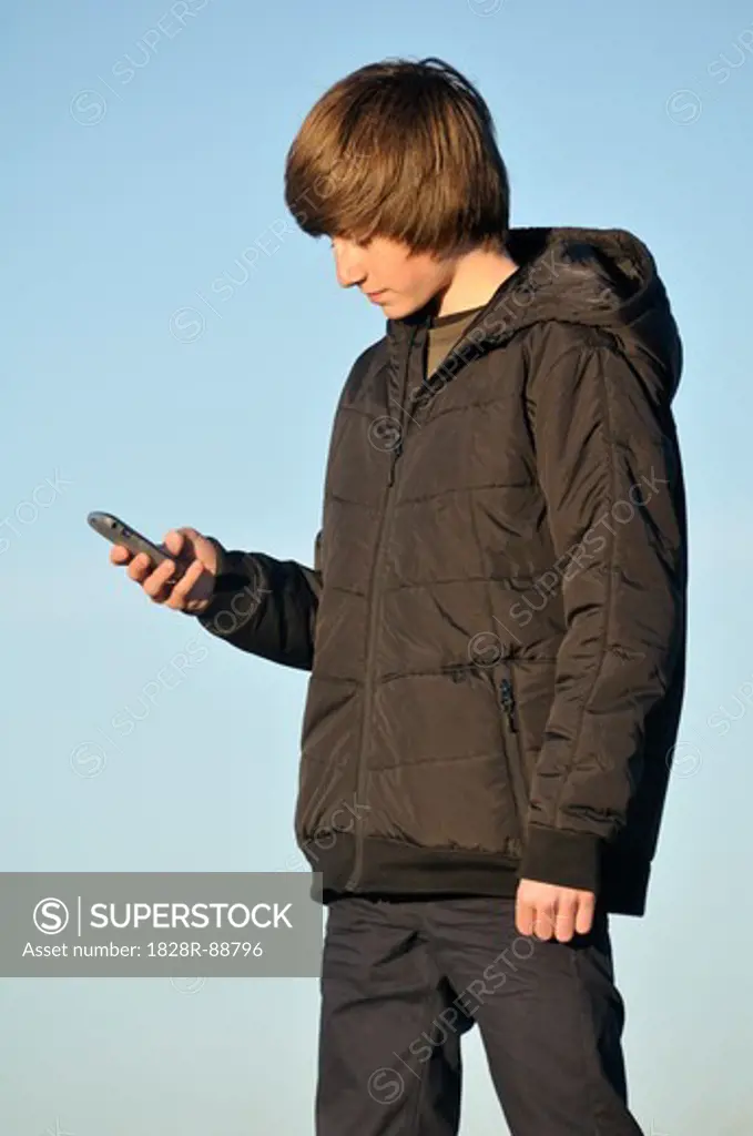 Teenage Boy using Cell Phone, Rogues, France