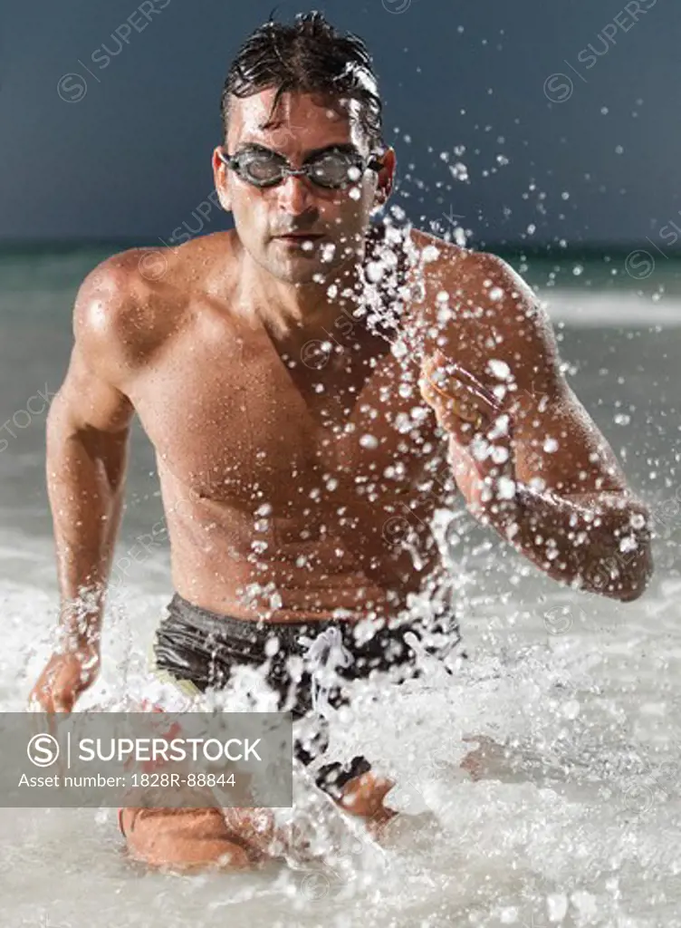 Swimmer Running out of Water, Miami Beach, Florida, USA