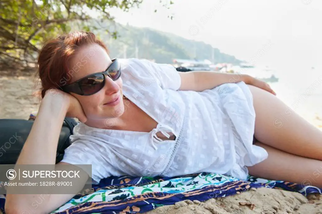 Woman Lying on Beach, Paraty, Costa Verde, Brazil