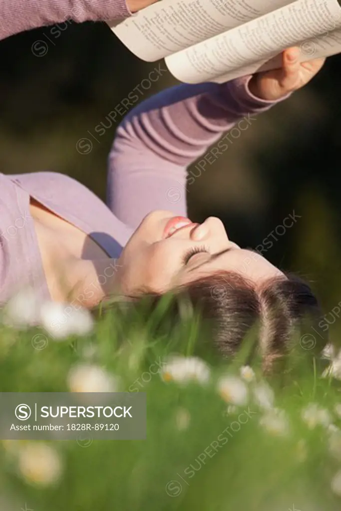 Woman Reading in Grass