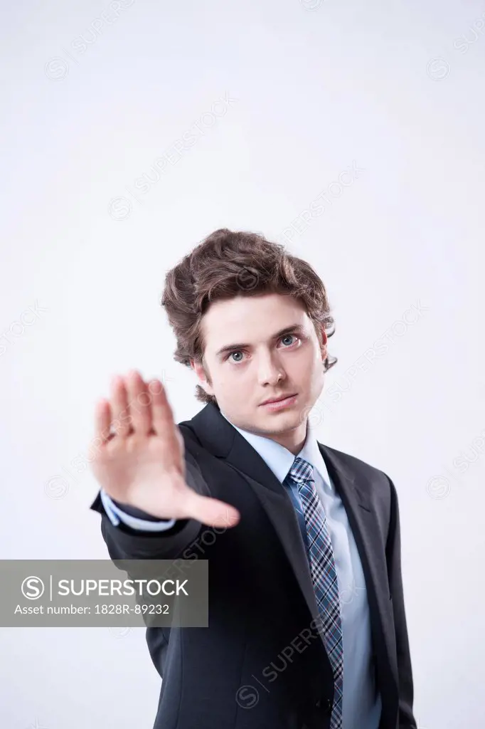 Portrait of Young Businessman using Hand Gesture