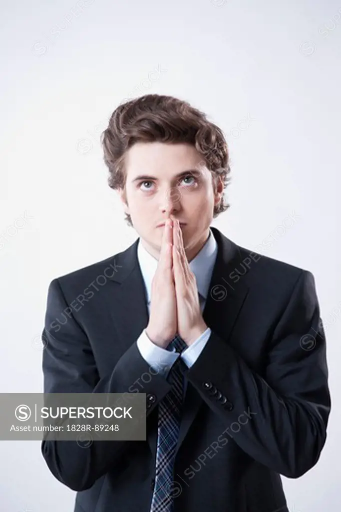 Young Businessman Praying