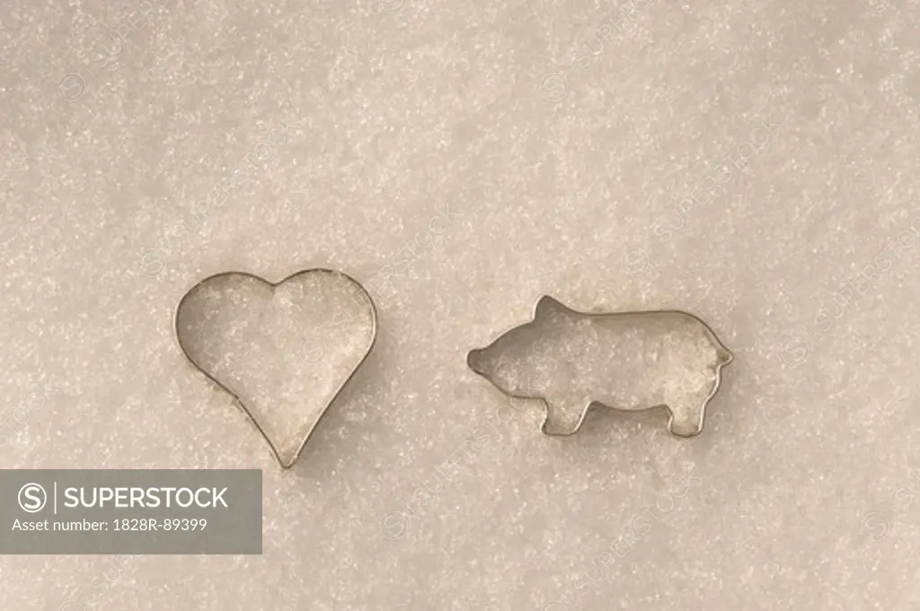 Pig and Heart-Shaped Cookie Cutters in Snow