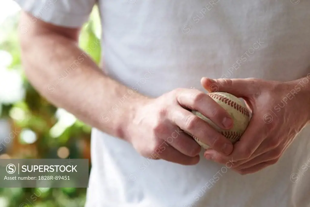 Man Holding Baseball