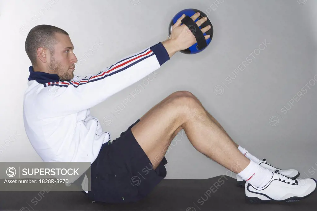 Man Using Medicine Ball   