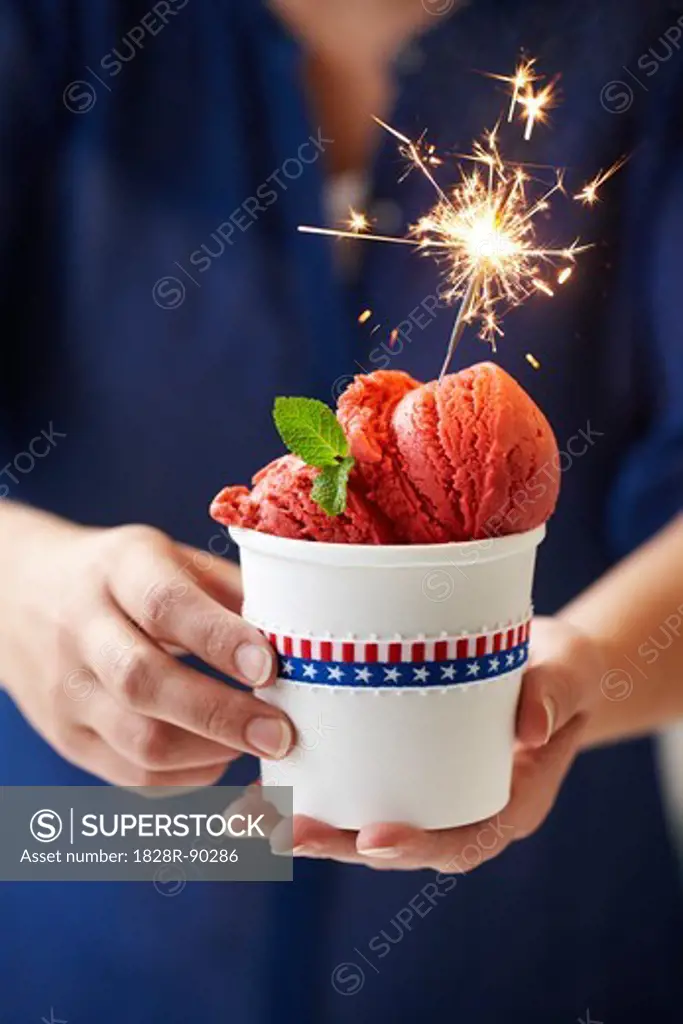 Woman Holding Cup of Berry Ice Cream with Sparkler