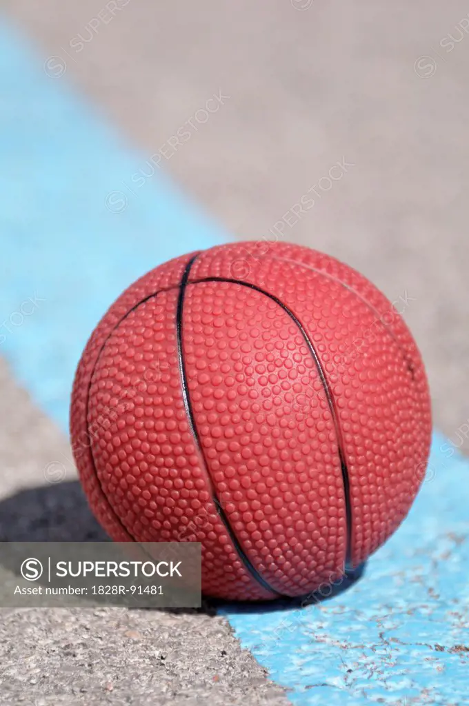 Close-up of Basketball on Pavement