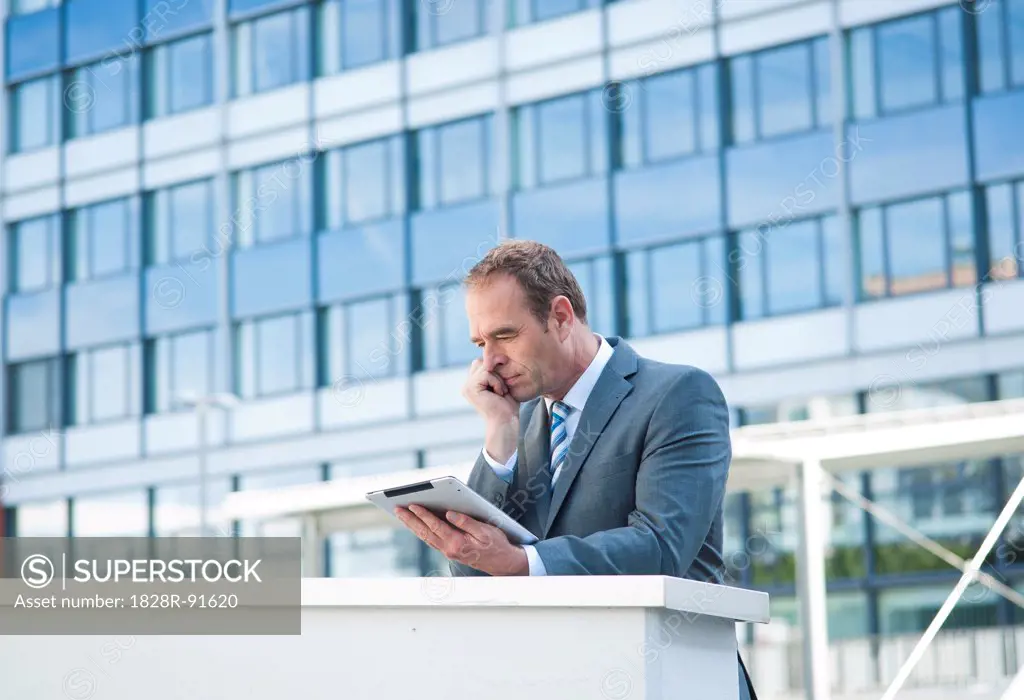 Businessman using Tablet PC, Niederrad, Frankfurt, Germany