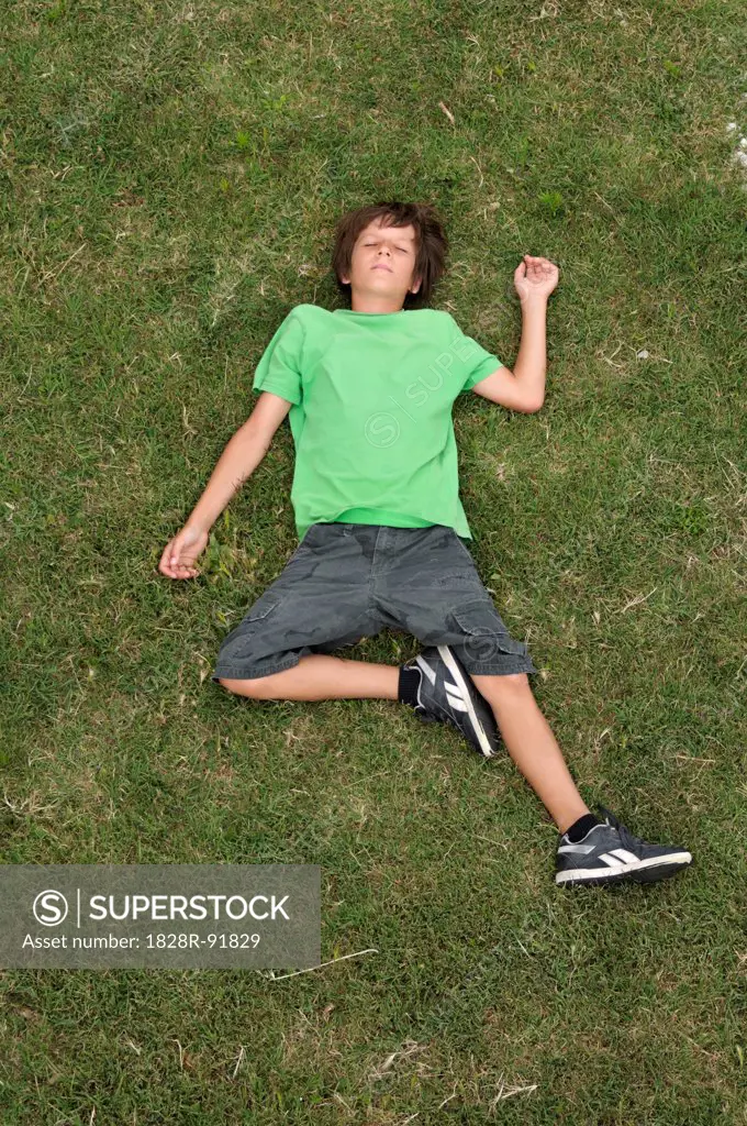 Boy Lying on Grass, Ile de Re, Poitou-Charentes, France