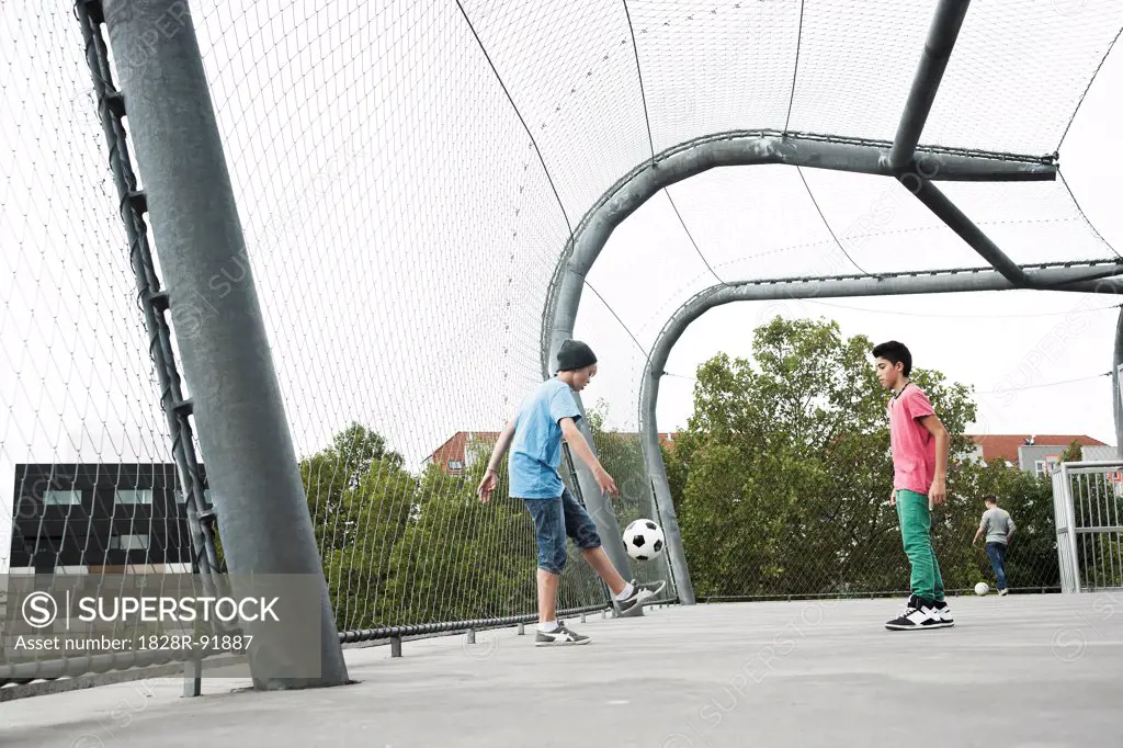 Boys Playing Soccer in Playground, Mannheim, Baden-Wurttemberg, Germany