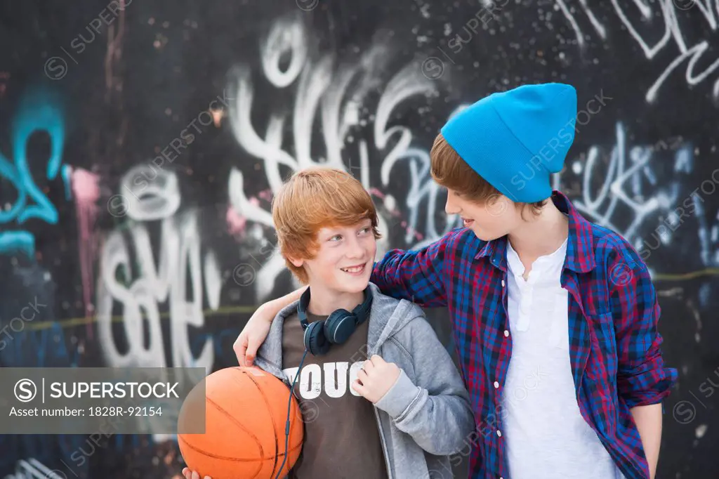 Boys with Basketball by Graffiti Covered Wall, Mannheim, Baden-Wurttemberg, Germany
