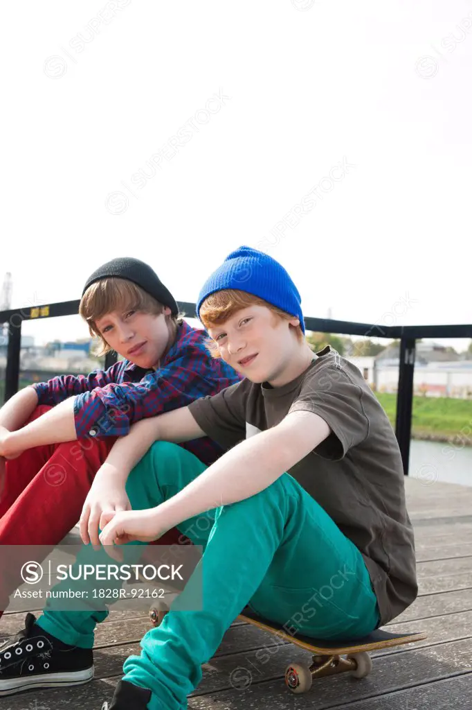 Boys Sitting on Skateboards, Mannheim, Baden-Wurttemberg, Germany