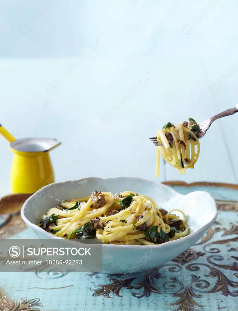 Pasta with Oysters and Spinach in Bowl on Tray with Fork