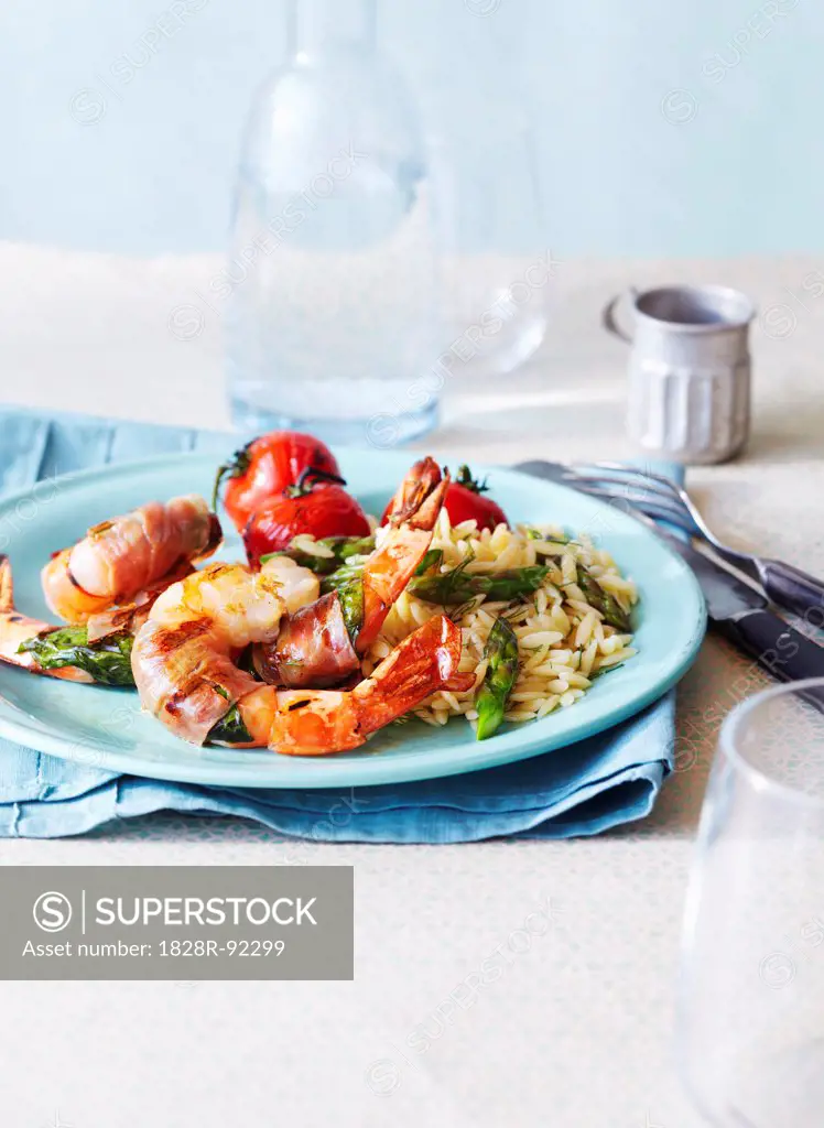 Prosciutto wrapped Shrimp with Orzo and Asparagus and Tomatoes