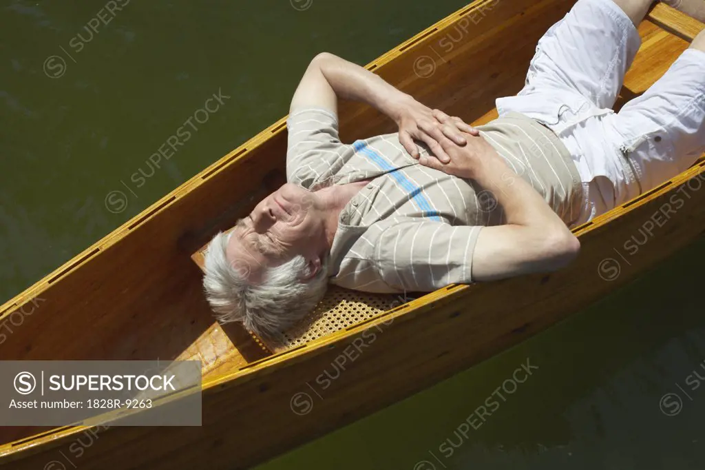 Man Sleeping in Canoe   