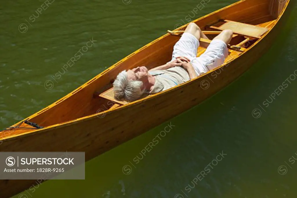 Man Sleeping in Canoe   