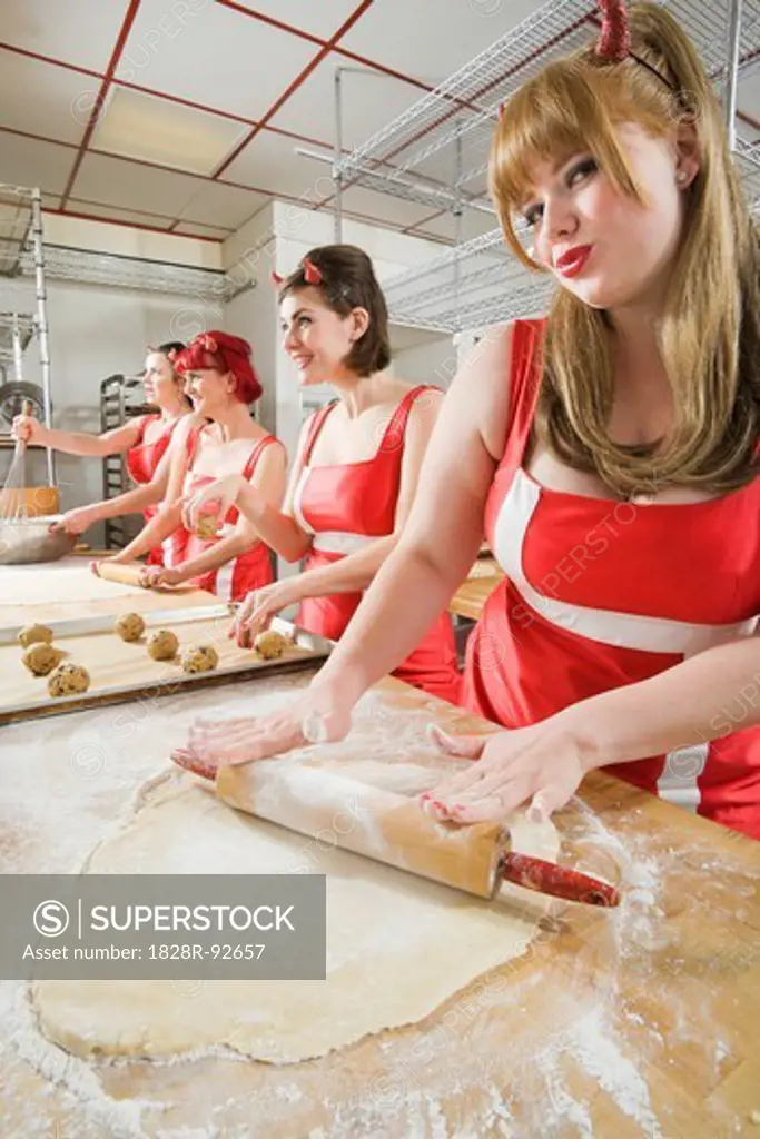 Women Wearing Devil Horns Working at a Bakery, Oakland, Alameda County, California, USA