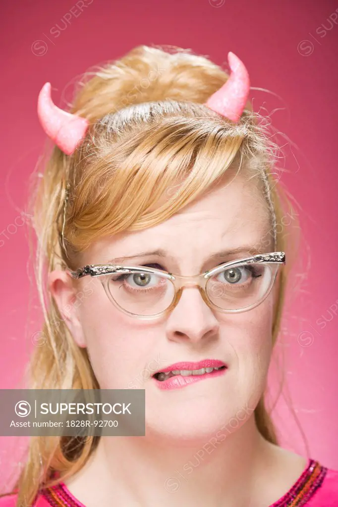 Portrait of Woman Wearing Devil Horns and Vintage Eyeglasses