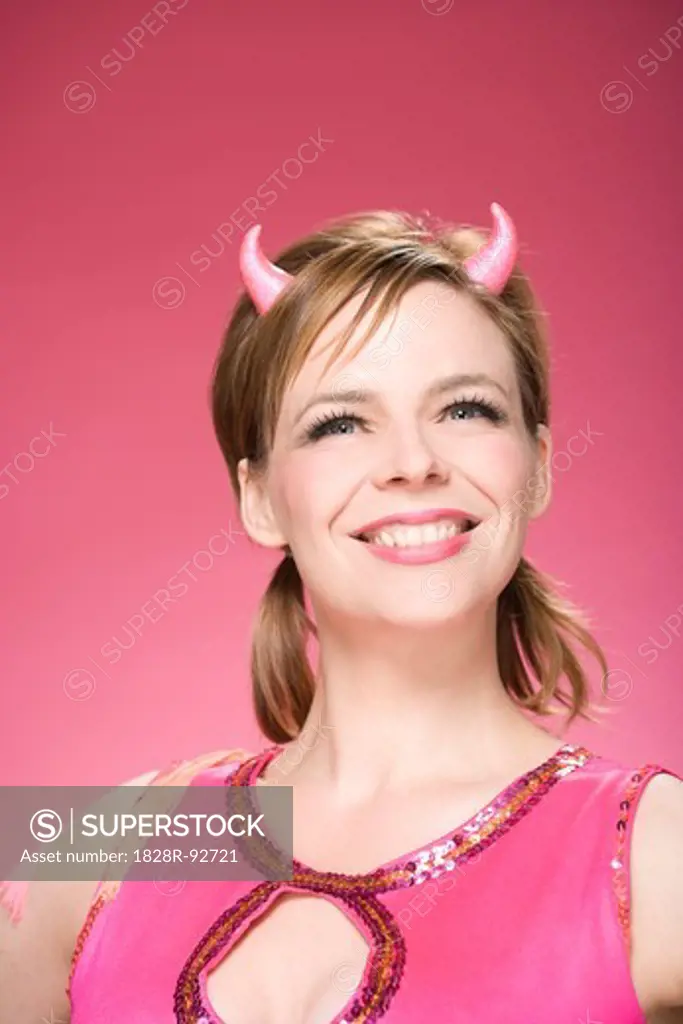 Portrait of Woman Wearing Devil Horns