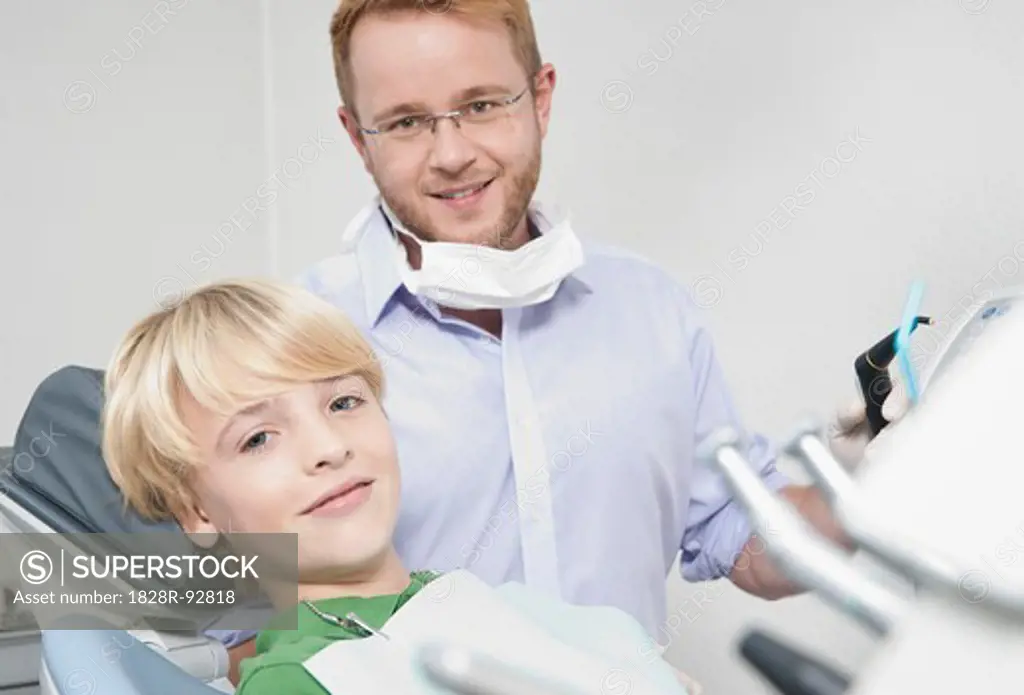 Portrait of Boy in Dentist's Chair with Dentist for Appointment, Germany