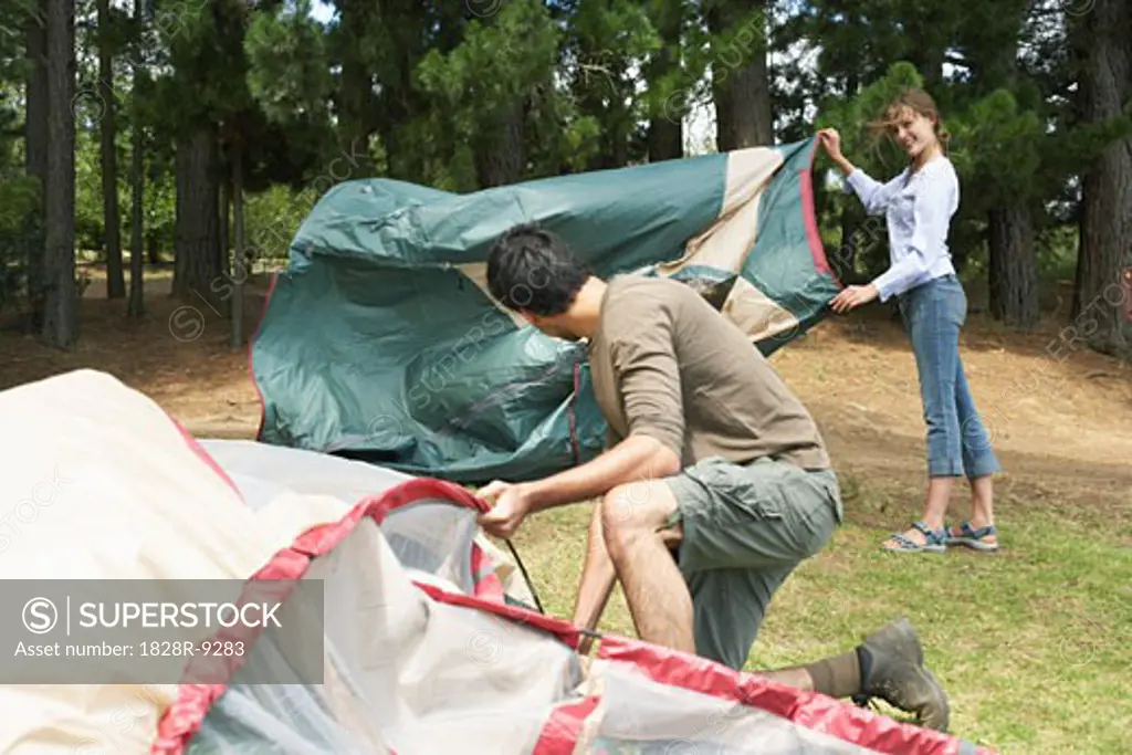 Couple Putting up Tent   