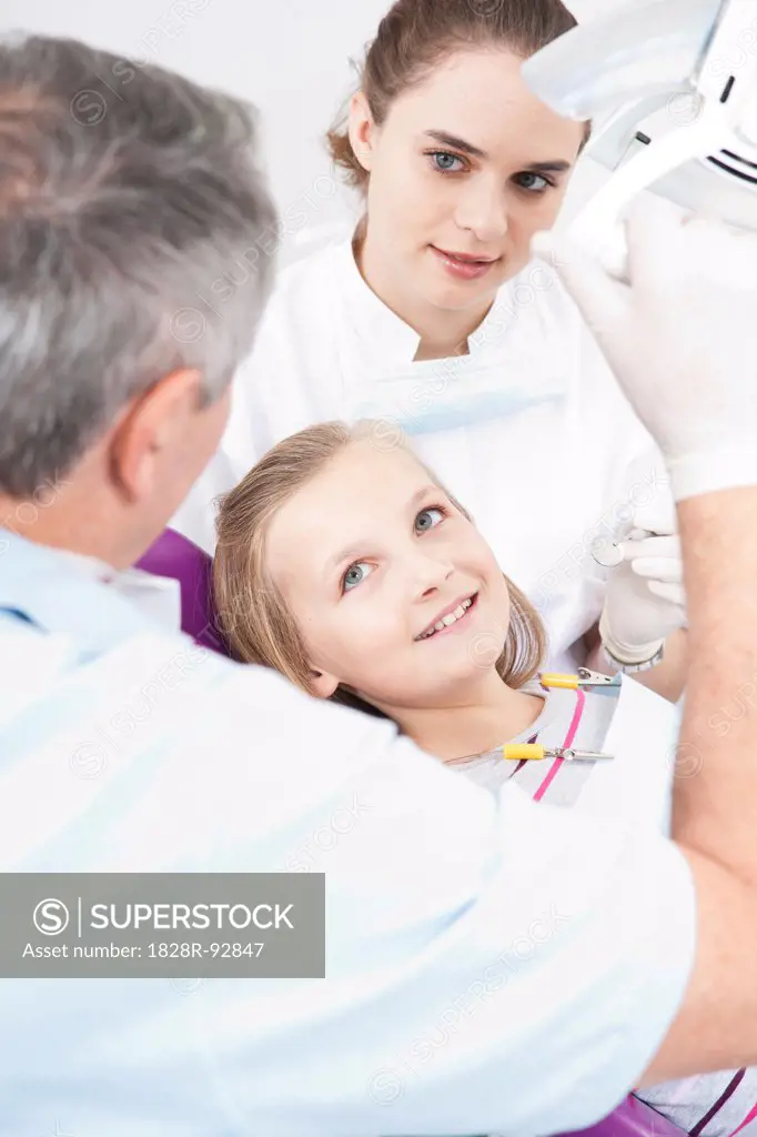 Girl with Dentist and Hygienist at Dentist's Office, Germany