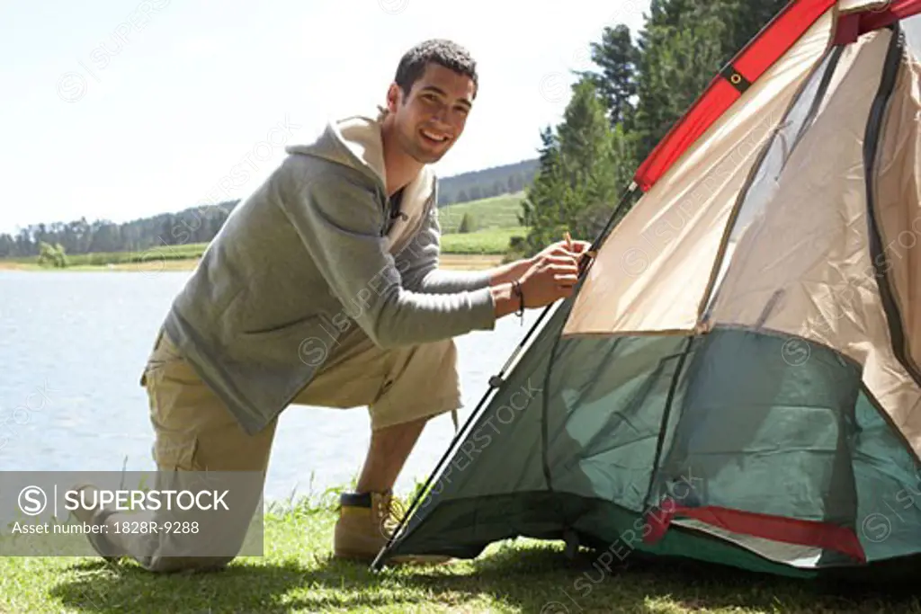 Man Putting up Tent   